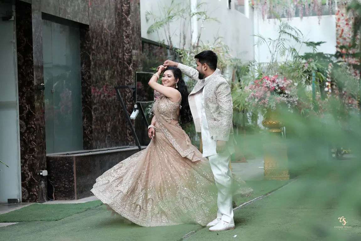 Nishtha twirling in her lehenga as Akshay spins her