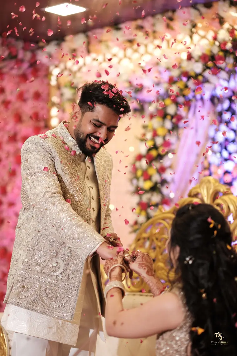 The ring ceremony under a shower of rose petals